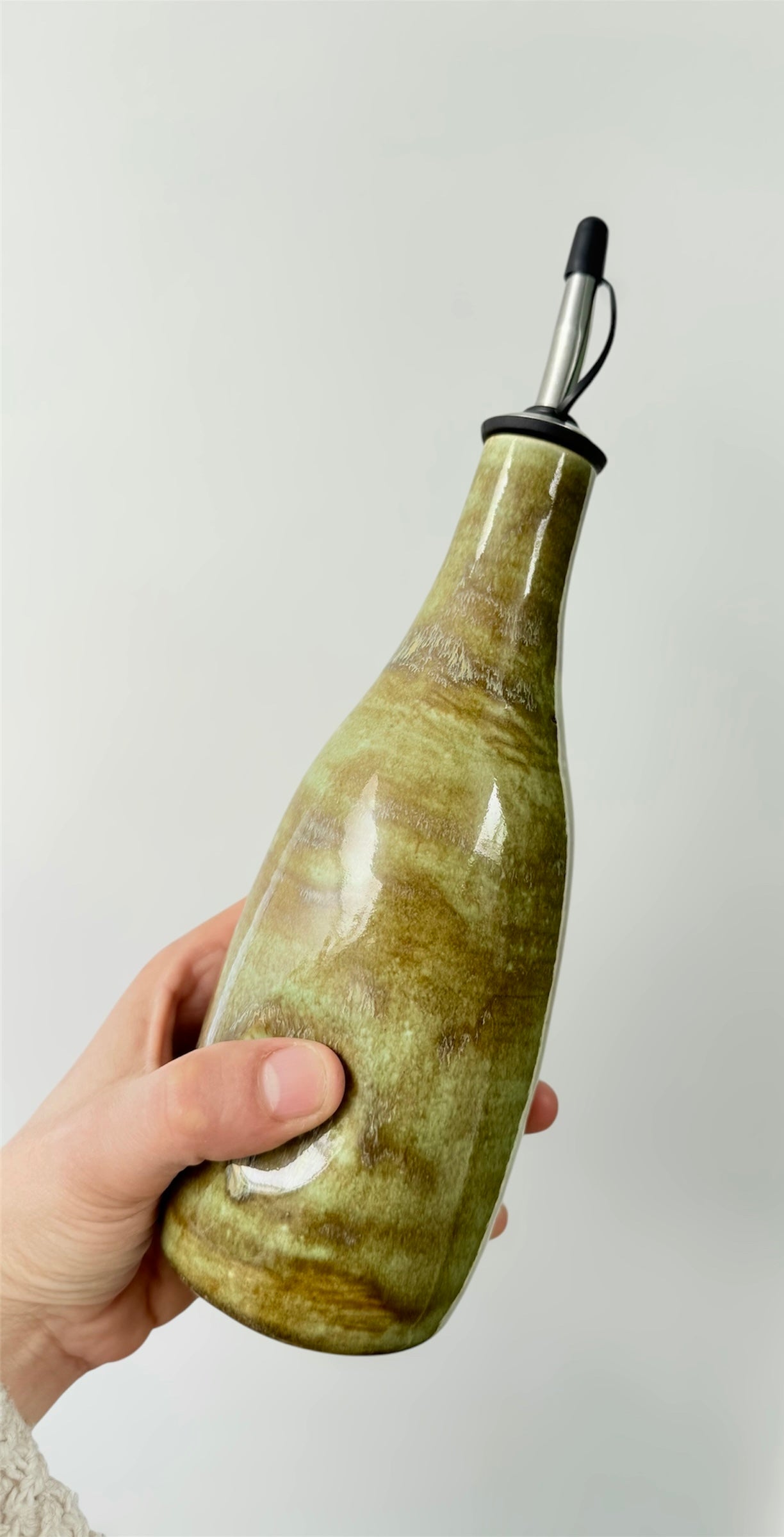 Thumb olive oil bottle